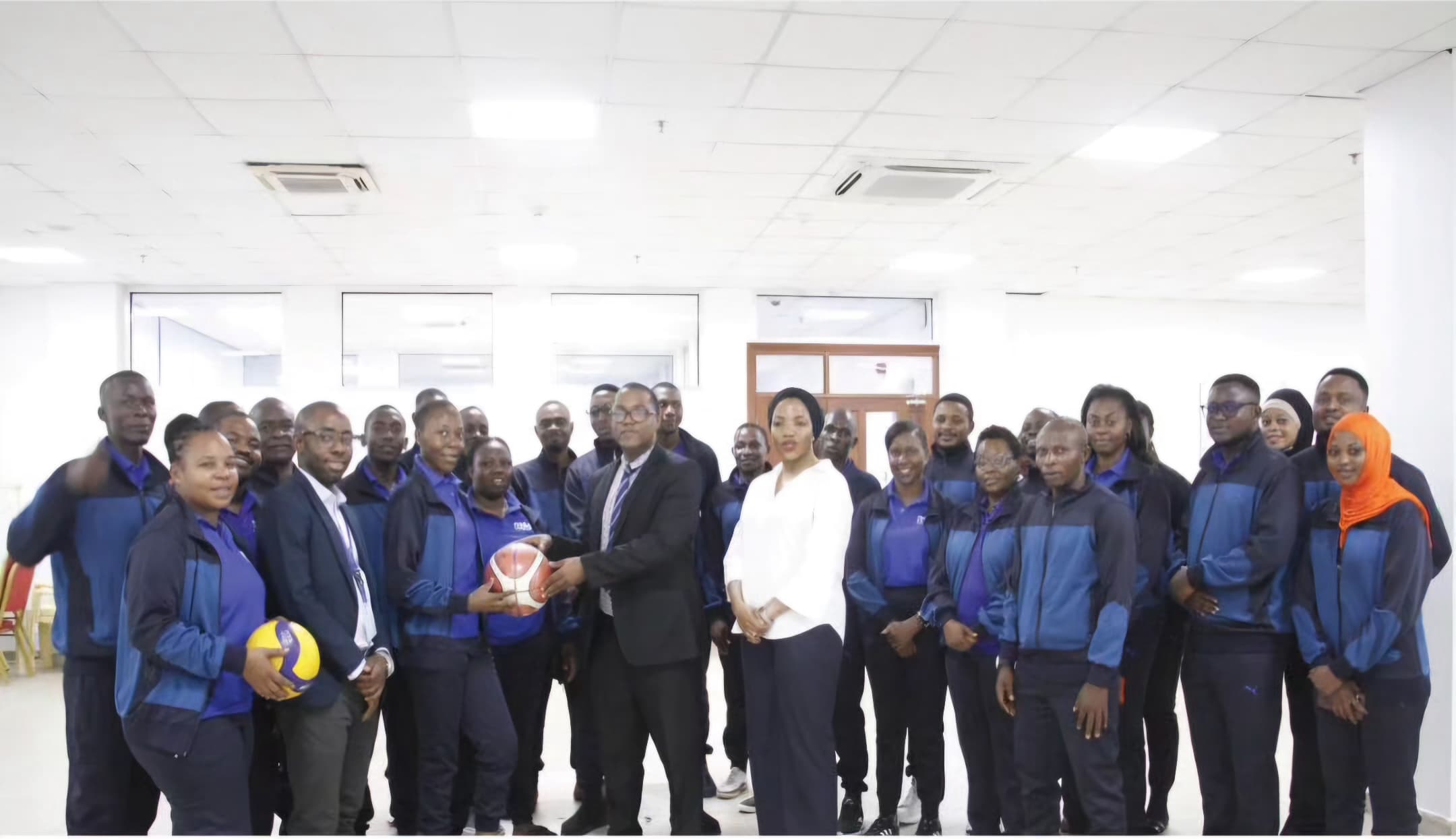 The Management of the Drug Depot (MSD) Presents the Flag to MSD Athletes, Shortly Before Participating in the SHIMUTA Championships