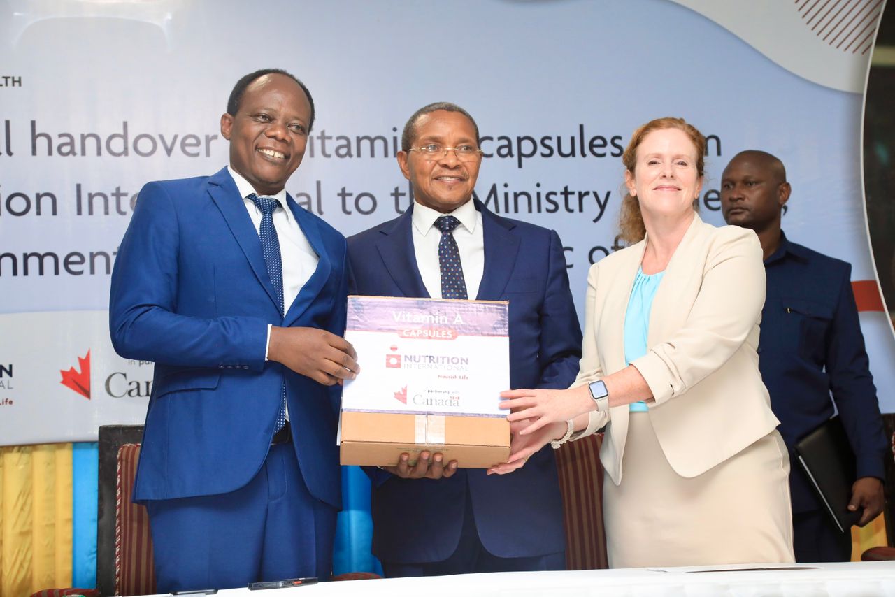 Retired Fourth Term President Dr. Jakaya Mrisho Kikwete, Handing Over Vitamin A Drops to the Minister of Health, on behalf of Nutrition International (NI) of Canada.