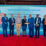 MSD Customer Service Officer Dar es Salaam Region Ms. Diana Kimario Receiving an Award from the Official Guest and Minister of Health of the Revolutionary Government of Zanzibar on behalf of MSD Leadership, During the International Heart Disease Conference